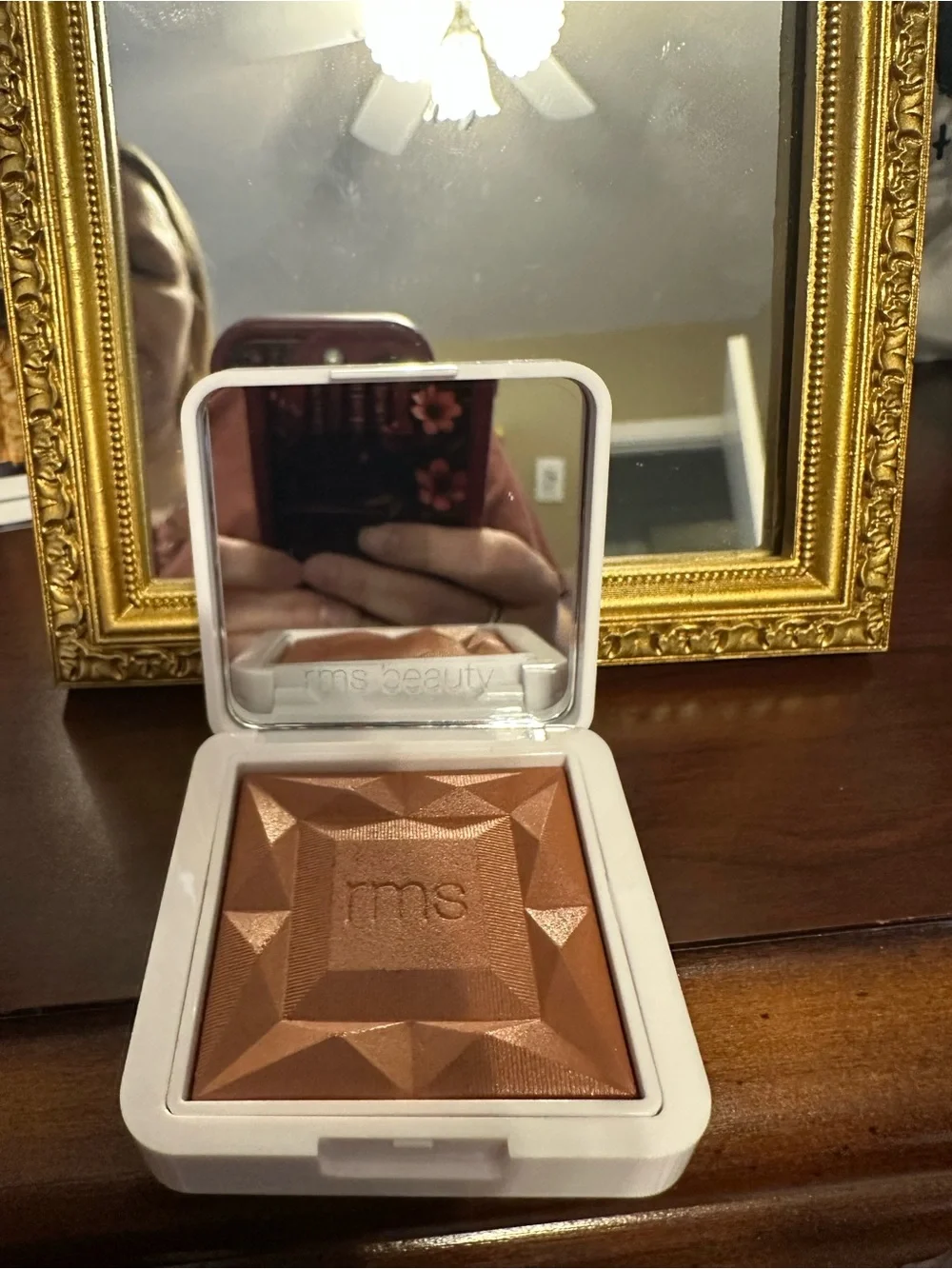 RMS Beauty compact in white with red logo